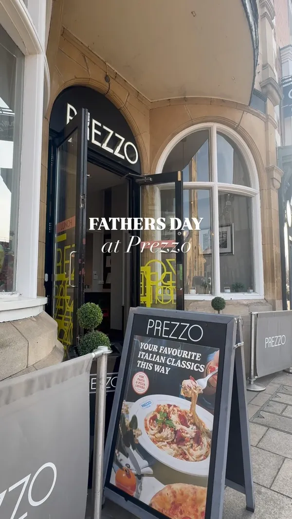 The video showcases a Father's Day visit to a Prezzo restaurant. It begins with an exterior shot and text overlay, then moves to the outdoor seating area. The video features various Italian dishes and drinks, including king prawns, bruschetta, lobster ravioli, Tuscan beef, pizza, wine, and beer. It highlights a Father's Day promotion involving bottomless beers for telling a joke. Shots include food close-ups, drinks, and people enjoying the meal and interacting with staff.