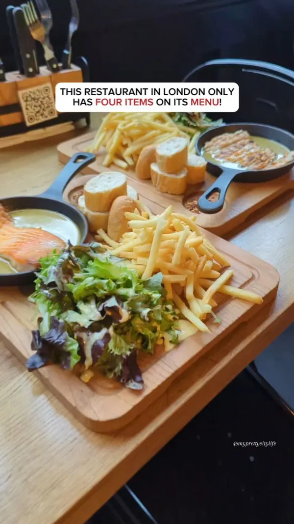 The video showcases Swiss Butter restaurant in Holborn, London. It highlights a platter featuring chicken and salmon, both cooked in a signature Swiss butter sauce, alongside fries, bread, and salad.  The molten chocolate lava cake is also featured.  The primary focus is presenting the restaurant's food and emphasizing its affordability (£19 for the platter).