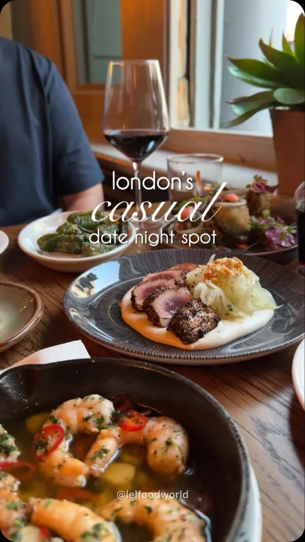 The video showcases Opera Tavern, a Spanish and Italian fusion restaurant in Covent Garden, London.  It features various tapas-style dishes, including tuna, beef, prawns, and churros. The food is presented elegantly on plates and in small pans.  The video also includes shots of the restaurant's interior and exterior. No specific dietary information is provided. The main focus is showcasing the food and ambiance of the restaurant.