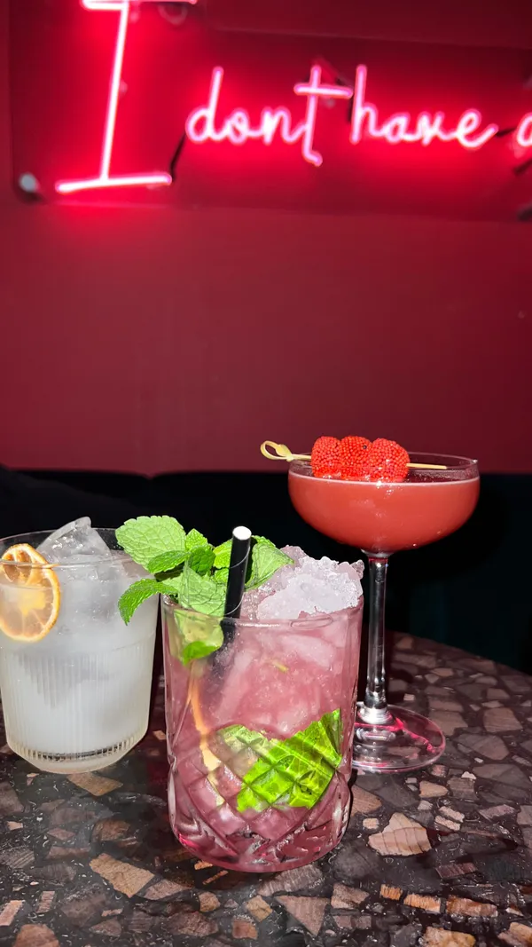 The video showcases a night out at Tequila Mockingbird, a bar in Covent Garden, London. It highlights three signature cocktails: the Calypso, The Zombie, and a Strawberry & Watermelon Martini.  The cocktails are presented in various glasses and garnished with fruit. The video focuses primarily on the cocktail preparation and the vibrant atmosphere of the bar. No specific dietary information is provided.