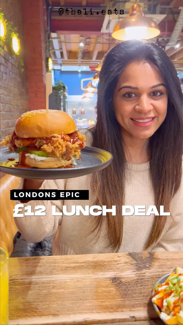 This video showcases Wingmans, a restaurant in Kilburn, London, offering a £12 weekday lunch deal. The deal includes a main, side, and drink. The video highlights various dishes, including buffalo wings, truffle mac and cheese, a BBQ burger, and fire fries.  The food is presented appetizingly. No specific dietary information is provided.