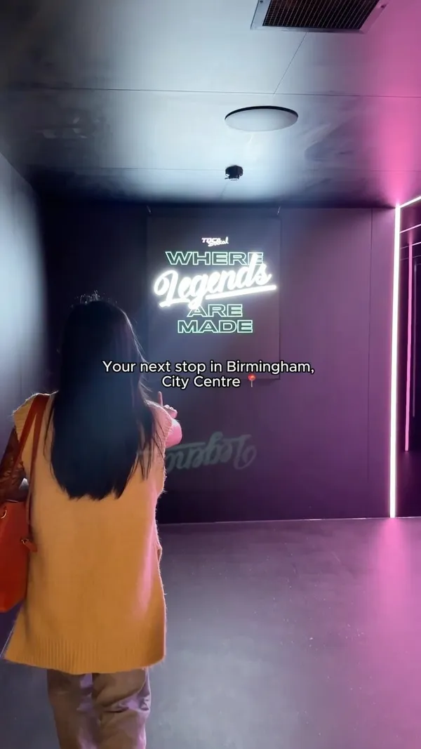 The video showcases Tocas Social, a new venue in Birmingham city center. It highlights the venue's design, emphasizing its modern and sleek aesthetic, including neon signs and a vibrant atmosphere.  The video features various food items, including mini burgers, potato wedges, dumplings, and empanadas. These dishes are presented in a visually appealing manner, with focus on vibrant colors and appealing textures. The video also shows the venue's gaming area, featuring interactive football-themed games. There is no information on any dietary options or restrictions. The primary focus of the video is to showcase the overall experience and atmosphere of the establishment.