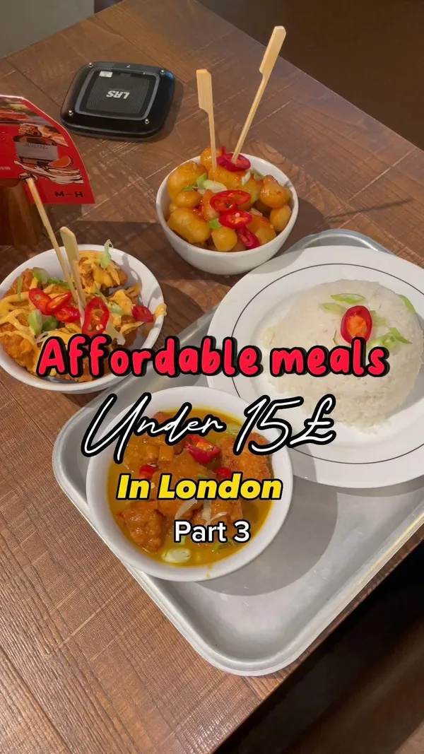 The video showcases Inamo restaurant in Market Halls Oxford Street, London, offering affordable Asian street food. It features various dishes: Chicken Karaage, Bang Bang Cauliflower, Dragon Roll with Tempura Shrimp, and Chicken Katsu Curry with Rice. The presentation includes close-up shots of the food, focusing on textures and colors. The video also shows Japanese Ramune soda.  No dietary information is explicitly provided.