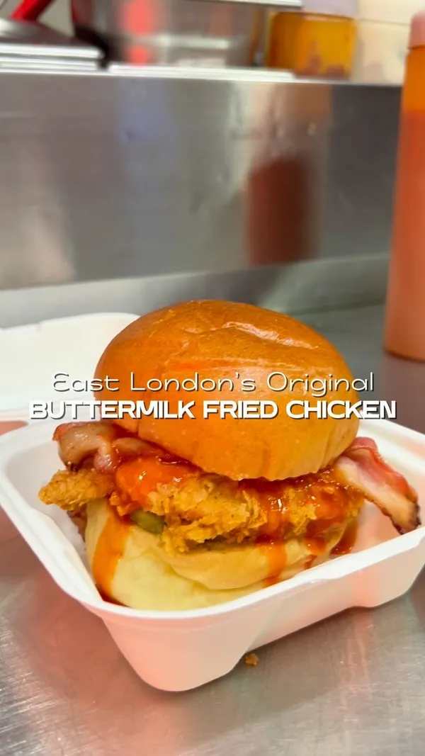 The video showcases a variety of fried chicken dishes from Butchies Fried Chicken in London. It features burgers with various toppings (including bacon and guacamole), chicken tenders, fries (plain, spicy, and with gravy), halloumi fries with chilli honey, and dipping sauces. The setting is primarily the restaurant's kitchen and a customer's home.  The food is presented in a visually appealing way, using various angles and shots to emphasize textures and colors.  No dietary information is explicitly provided. The main focus is on showcasing the food and the positive eating experience.