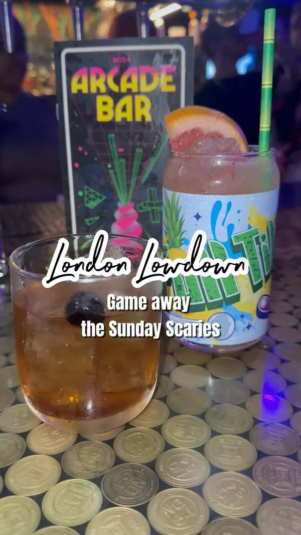 This video showcases NQ64 Shoreditch, a retro arcade bar in London.  It highlights the bar's atmosphere, themed cocktails (including a star-shaped cocktail), and various arcade games like Dance Dance Revolution, basketball, Guitar Hero, and Mario Kart. The video emphasizes the fun, social aspect of the bar and its Sunday Level Up special.