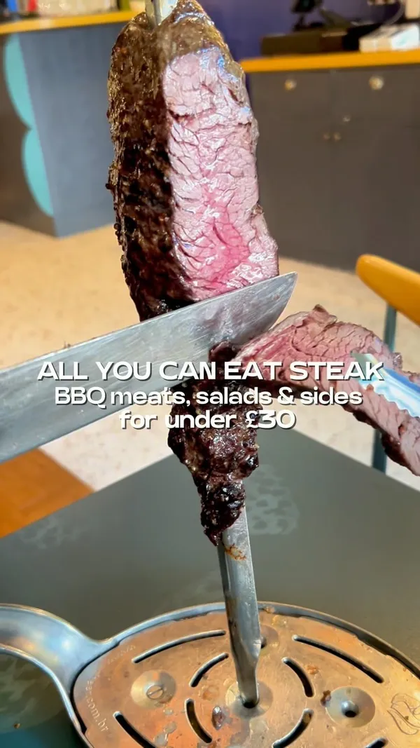 This video showcases Preto Restaurant, specifically their new Angel branch.  The video highlights their all-you-can-eat rodizio grill offer, featuring various BBQ meats (steak, chicken wings, sausages, ribs), salads, Brazilian sides (rice, beans), and desserts (passion fruit cake and caramel cheesecake).  The food is presented on skewers, plates, and in bowls. The presentation emphasizes the variety and abundance of food. No specific dietary information is provided. The video mainly focuses on a meal showcase.