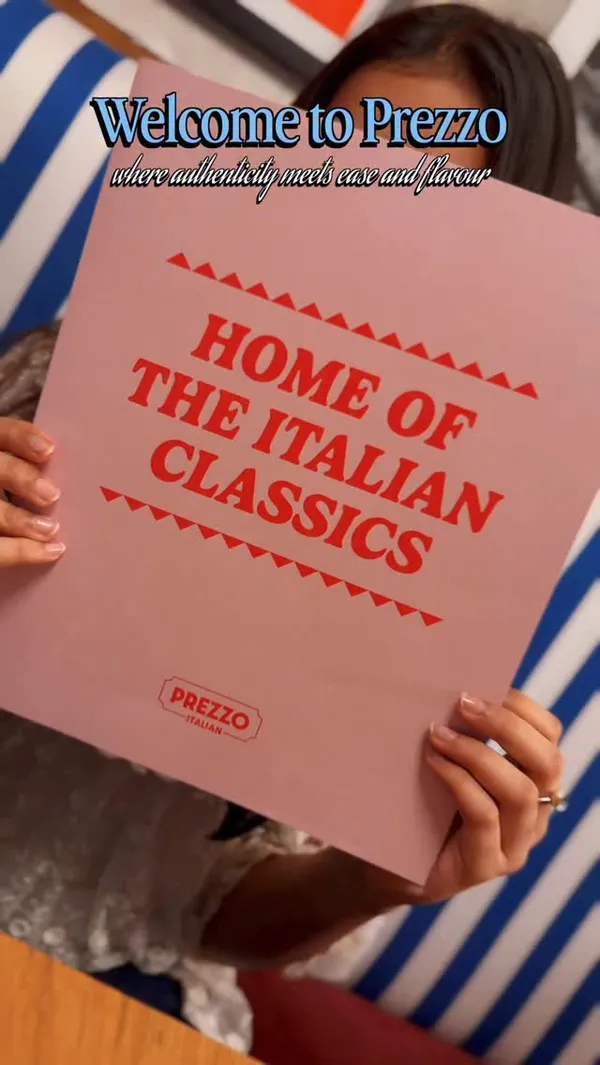 A promotional video for the Italian restaurant chain Prezzo. The video is a fast-paced montage showcasing the restaurant's interior, decor, and a variety of dishes. Food items featured include pasta with grated cheese, fried shrimp with a dipping sauce, hummus with flatbread, garlic shrimp, a prawn and rocket pizza, truffle fries, and lemon meringue pie. The video also shows cocktails and highlights that the restaurant offers extensive gluten-free options and a special weekly offer.