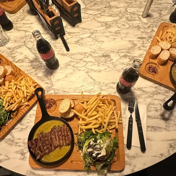 If by any chance you do live under a rock and haven’t seen @swissbutter on your fyp yet, this is your sign to try it.
First off I’m not a huge steak person, slicing a huge chunk of meat with not much flavour is not my idea of fun, however this place is literally the opposite, the steak comes perfectly cooked(!), with a really nice buttery flavoursome sauce to smother it in and all the perfect sides, you can also choose between a baked potato or fries and both are great options! 

The price point of this is so good for somewhere halal and in central! At £19 for the entire platter and being able to choose between 2 cuts of beef, chicken and fish there really is something for everyone on this concise menu 😂.

They don’t currently take reservations but worth going and waiting for! If you guys have been let me know how you found it? @joli_app