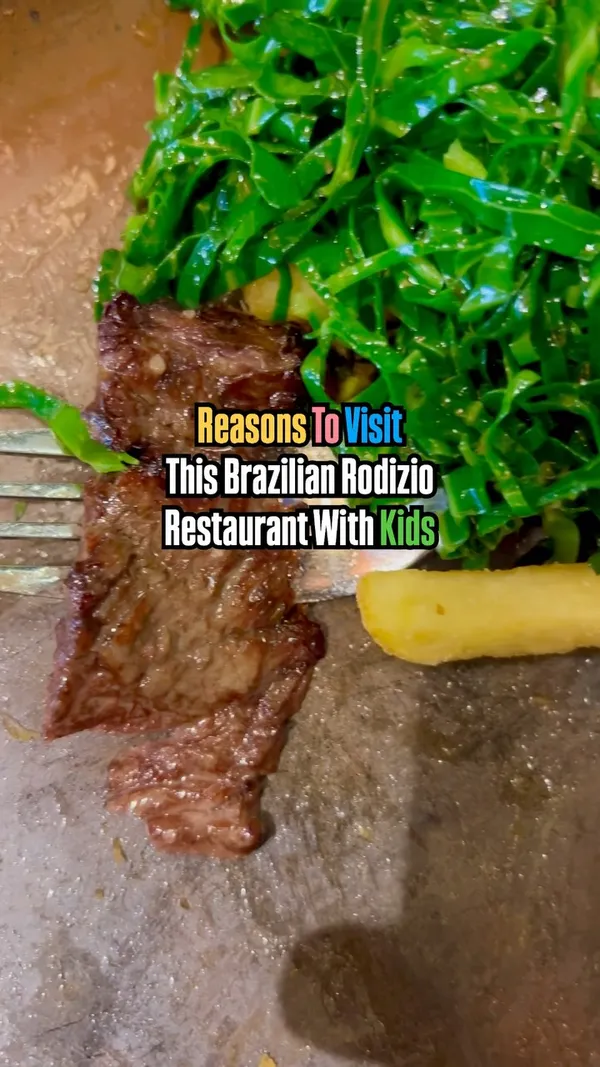 This video promotes Preto, a Brazilian steakhouse in Islington. It showcases the restaurant's exterior and interior decor, highlighting its colorful and vibrant atmosphere. The video features an all-you-can-eat buffet with various dishes, including salads, rice, vegetables, and grilled meats served rodizio-style. Drinks like mojitos and desserts such as grilled pineapple and ice cream are also shown. The main focus is on the variety and abundance of food and the family-friendly dining experience.