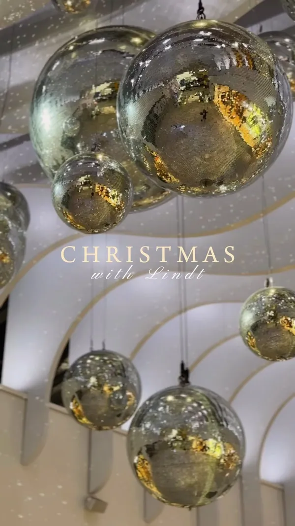 The video showcases Lindt's Christmas offerings at their store in the O2 Arena, London.  It features various chocolate products, including Lindor truffles, chocolate teddy bears, and a Pick & Mix section where customers can create their own Advent calendars. The video emphasizes the festive atmosphere, both in the store's decoration and its products. 
