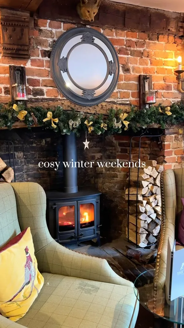 This video showcases a dog-friendly hotel, The Dog at Wingham, in Kent, England. It highlights various aspects of the hotel, including its cozy rooms with fireplaces, a dining area with a round table set for a meal, breakfast options (fried eggs, bacon, and fruit salad), and a relaxing seating area. The video emphasizes the hotel's charming atmosphere and dog-friendly environment.