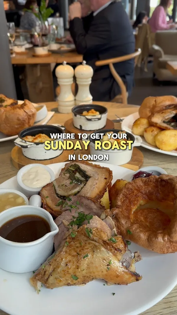 This video showcases a Sunday roast at No17 Dickens Yard restaurant in Ealing, London.  It features various dishes, including crostini with different toppings (avocado, prawn cocktail, prosciutto), a mixed roast with pork belly, beef, and chicken, along with Yorkshire puddings, roasted potatoes, and assorted sauces. Desserts shown include affogato and brioche pain perdu. The video emphasizes the food's visual appeal and the restaurant's ambiance.