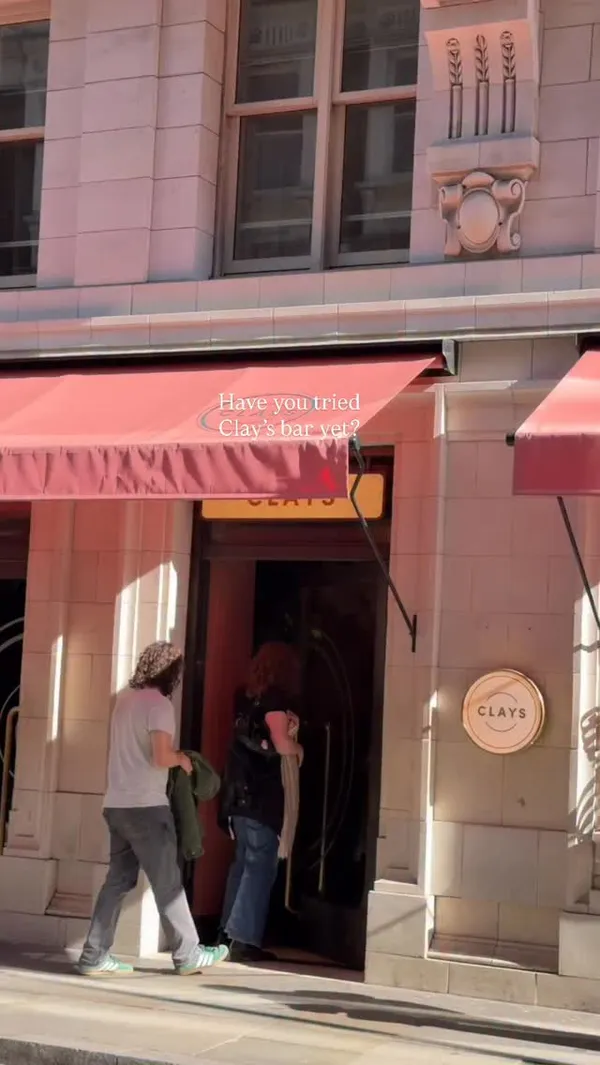 A promotional reel for Clays, a venue that combines a bar with a digital clay shooting experience. The video features shots of the exterior, the stylish interior, people playing the shooting games, and close-ups of cocktails.