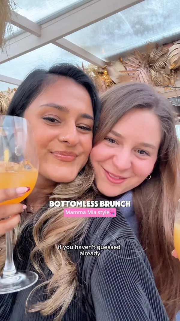 This video showcases a bottomless brunch experience at Circe's Rooftop Bar in Waterloo, London. The video features two women enjoying cocktails and the atmosphere of the bar. The food shown includes flatbreads topped with vegetables and fries, and lemon cake. The presentation of the food and drinks is casual and inviting. The main focus is on the bottomless brunch experience, including the drinks, food, and live ABBA music.