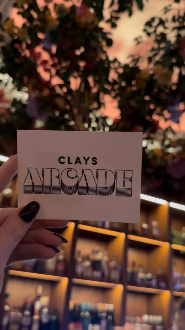 A short, energetic video showcasing a visit to Clays Arcade in Soho, featuring clips of the venue's decor, the clay shooting simulator gameplay, and cocktails.