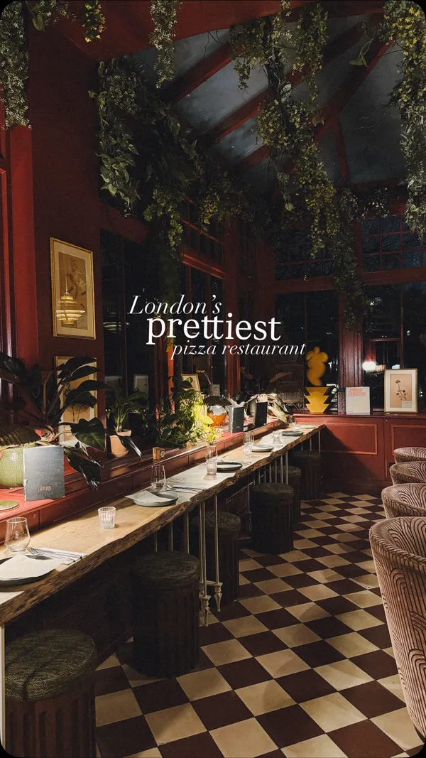 A visually appealing reel showcasing the interior and food at EVE in Kensington. The video features slow, cinematic pans of the restaurant's red-themed decor and close-ups of pizza, fries, and a cocktail.