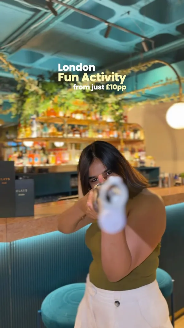 A vlog-style video showcasing a visit to Clays Bar, an interactive virtual clay shooting venue in London. The creator demonstrates the shooting activity, highlights the food and drink options available at the venue, and provides practical tips for visitors.