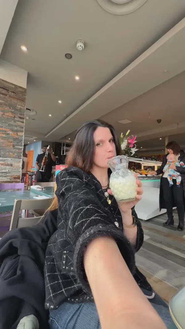 This video promotes Preto Restaurant, a Brazilian Rodizio-style restaurant in London. The video begins with a shot of a person holding a drink and then transitions to shots of various grilled meats on skewers, including chicken, sausage, picanha, and linguica. It also showcases the buffet with sides like mashed potatoes, cheesy pasta, fries, Brazilian cheese bread (pao de queijo), salads, sweet corn, and Brazilian black bean stew (feijoada). The presentation emphasizes the unlimited nature of the meat service, where servers carve meats directly onto the plate. Desserts like brigadeiro cake and flan are also featured. The video explains how the dining experience works, using a card system to indicate whether the customer wants more meat or is full. The main focus is on the Rodizio grill and the variety of meats offered.