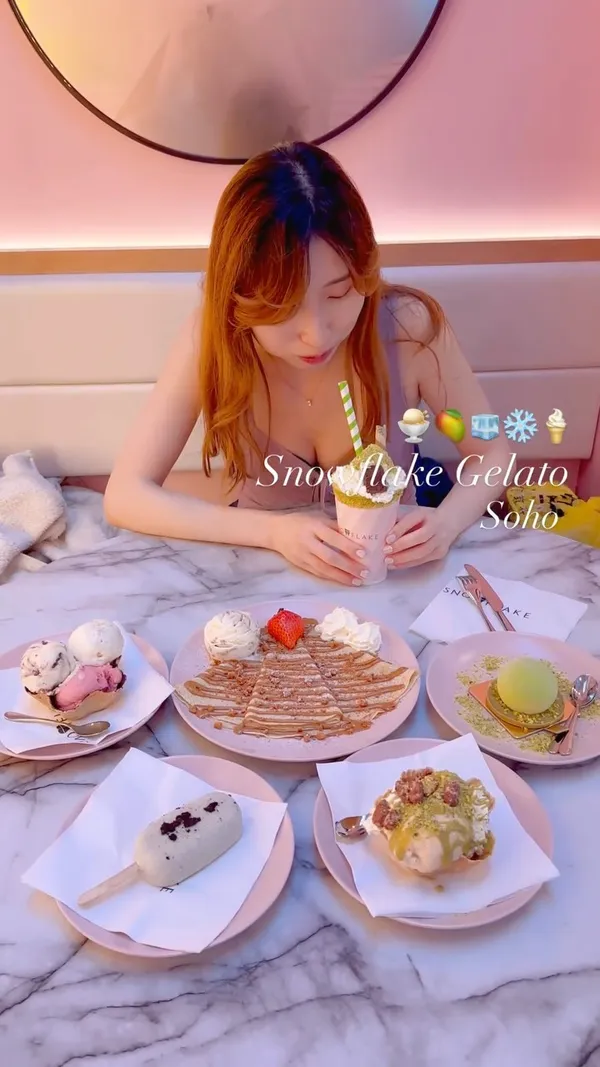 The video showcases Snowflake Gelato in Soho, London. It features various gelato flavors, including pistachio and hazelnut, and a Lotus Biscoff crepe.  The presentation is visually appealing, with pink plates and a clean aesthetic. Dietary information isn't explicitly provided, but the gelato uses organic Jersey milk. The main focus is on presenting the delicious-looking desserts.