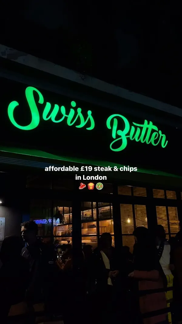 This video showcases Swiss Butter, a restaurant in Holborn, London. It features various dishes: ribeye steak, chicken, both served with a green butter sauce, chips, and salad; and desserts, including pain perdu (caramel French toast) and a molten chocolate cake.  The food is presented on wooden boards and in individual pans.  The video emphasizes that the food is halal and that alcohol is served. The main focus is on showcasing the food and the restaurant's ambiance.