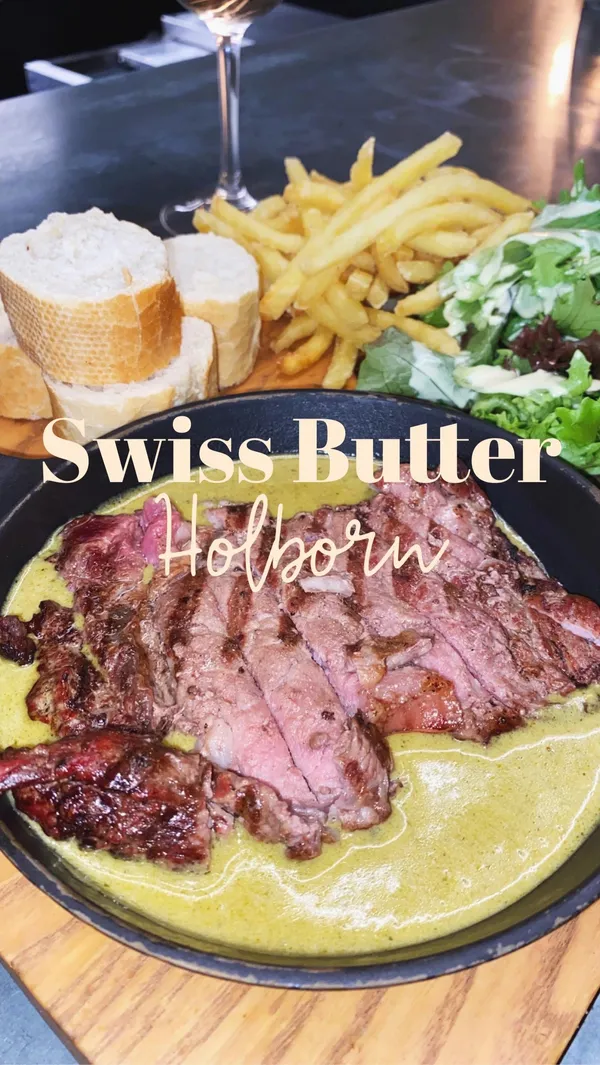 This video showcases a meal at Swiss Butter in Holborn, London.  The meal consists of a steak platter (£19pp) including sliced steak in a green sauce, fries, salad, and bread.  Dessert options shown include a chocolate lava cake and Pain Perdu (French toast). The video focuses on the visual appeal of the food and highlights the price point and lack of wait time.
