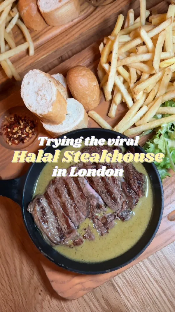 The video showcases a visit to a Halal steakhouse in London.  The influencer highlights their ribeye steak with Swiss butter sauce, served with fries and bread, and a molten chocolate cake for dessert. The restaurant's ambiance is subtly shown, focusing on the food presentation. Dietary information is provided through the 'Halal' description.