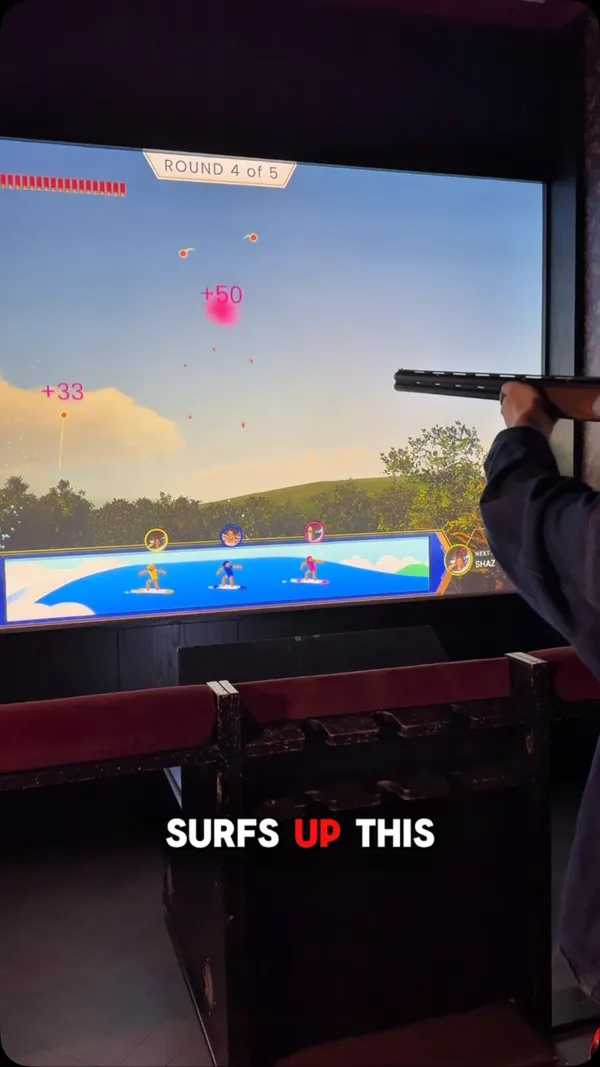 The video is a promotional vlog for Clays, a competitive socialising venue in London. It highlights their new virtual clay pigeon shooting game, 'Surf's Up,' while also showcasing the venue's food and drink offerings, including sliders, canapes, and various cocktails. The creator provides a tour of the space, including the outdoor terrace, and emphasizes the fun, competitive atmosphere suitable for groups.