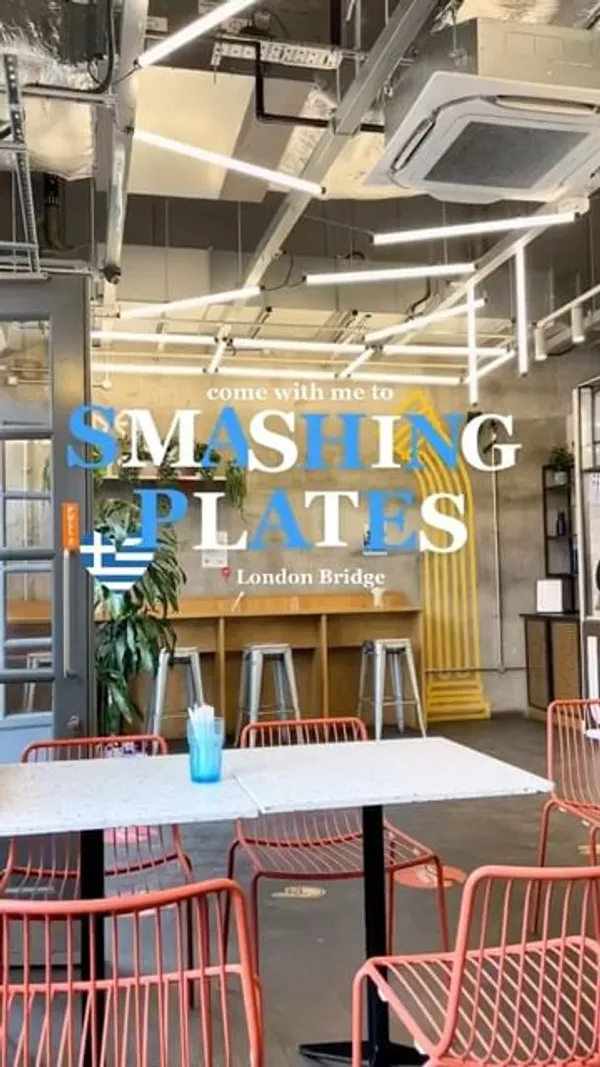 This video showcases a meal at Smashing Plates, a Greek restaurant in London Bridge.  The food presented includes a pork souvlaki platter, chicken and courgette bites, a Greek salad, a chicken gyro, and pittanuts (deep-fried pitta bread with cinnamon and chocolate sauce).  The food is displayed on the restaurant's branded paper. The video focuses on showcasing the various dishes offered by the restaurant. 
