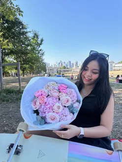 User sharing vibrant flowers and a longboard, capturing a joyful moment after recovering from a minor injury.