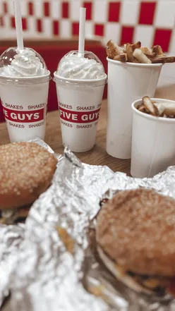 Enjoying a delicious burger and milkshake at Five Guys in the Metrocentre after a fun-filled day of shopping.