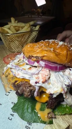 Inviting spread of new menu items at Carnivore by the Mine, including bao buns, burgers, and chocolate fondue.