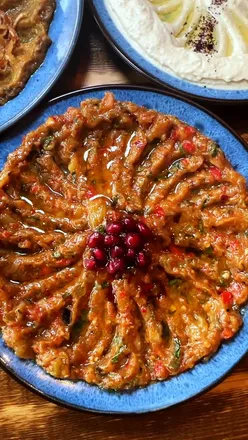 Delicious Mediterranean vegetarian dishes at Zest and Co restaurant in Leicester, featuring baba ghanoush, hummus, and pide.