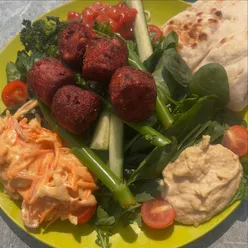 Vegan falafel salad enjoyed poolside at David Lloyd Cardiff, showcasing delicious plant-based lunch options.