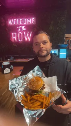 Enjoying a crispy halloumi burger and seasoned fries from The Beef Guy in Worthing.