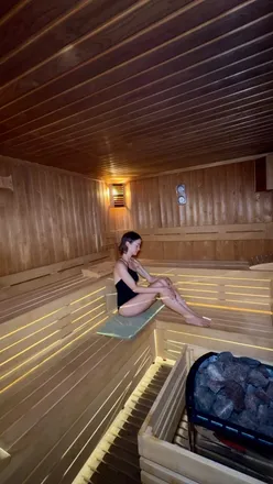 Relaxing in a sauna after using my gym membership, embracing wellness over workouts.