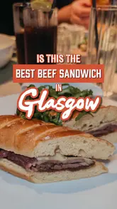 Delicious beef sandwich with gooey cheese and rich gravy at Trocadero in Crossbasket Castle, Glasgow's chic dining spot.
