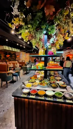 Group enjoying Mediterranean buffet at La Fiesta in Merrion Centre, Leeds, with endless food and drinks.