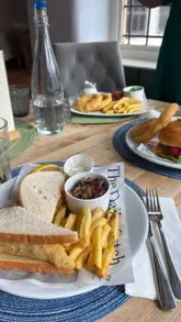 Cozy autumn scene at The Old Pheasant pub, showcasing delicious food and warm service in Leicester.