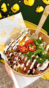 Delicious Indian rolls and bowls at Kool Kata Street Food in Longbridge, Birmingham, featuring tandoori chicken and flavorful toppings.