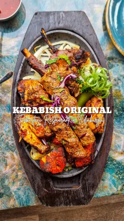 Mixed grill platter with chicken and lamb dishes at Kebabish Original, a vibrant restaurant in Edinburgh.