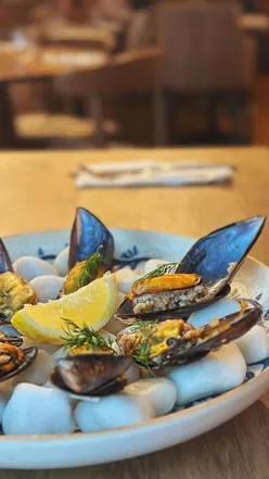 Warm interior of Longa Cardiff, showcasing elegant decor and vibrant atmosphere, perfect for a cozy dining experience.