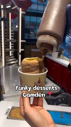 Chimney cake topped with Dubai chocolate ice cream from @hansandgretel.uk in Camden, a must-try dessert for sweet lovers.