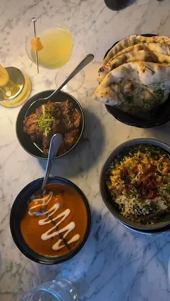 Delicious small plates at Indian Cafe Racer in Birmingham, featuring Papdi Chat, Gobi Manchurian, and Chicken Makhani.