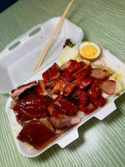 Delicious mix roast meats with egg and rice from Maxi's Rotisserie in Leeds Kirkgate Market.