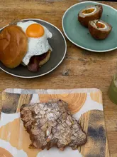 Breakfast at Wapping Wharf in Bristol: pastries from Mokoko Bakery and savory baps from Pigsty UK.