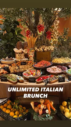 Guests enjoying an unlimited seafood brunch with lobster, oysters, and antipasti at Lavo, Bond Street, London.