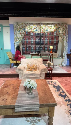 Friends fans enjoying trivia night at the Friends Experience, complete with drinks and prizes.