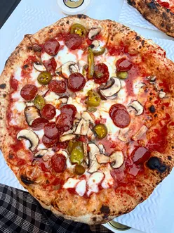 A delicious pizza and pasta meal featuring mushrooms at Borough Market in London, perfect for a Sunday treat.