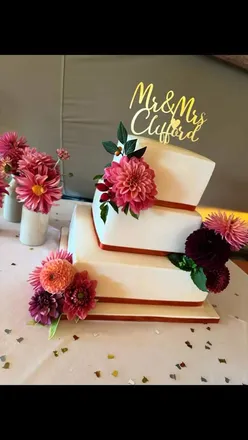 September wedding cake setup at Crescent Turner Whitstable, featuring fruit, vanilla, and gluten-free sponge tiers with autumn decorations.