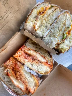 Delicious Chicken Caesar and Chicken Parm sandwiches at Focaccia Mia, Bethnal Green, showcasing a tasty menu battle.